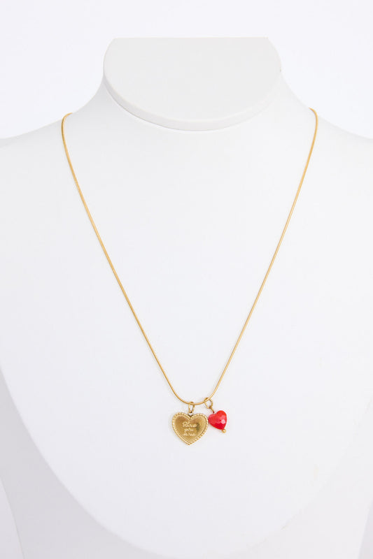 Love You More Necklace in gold with heart charm detailing, angled view on white background