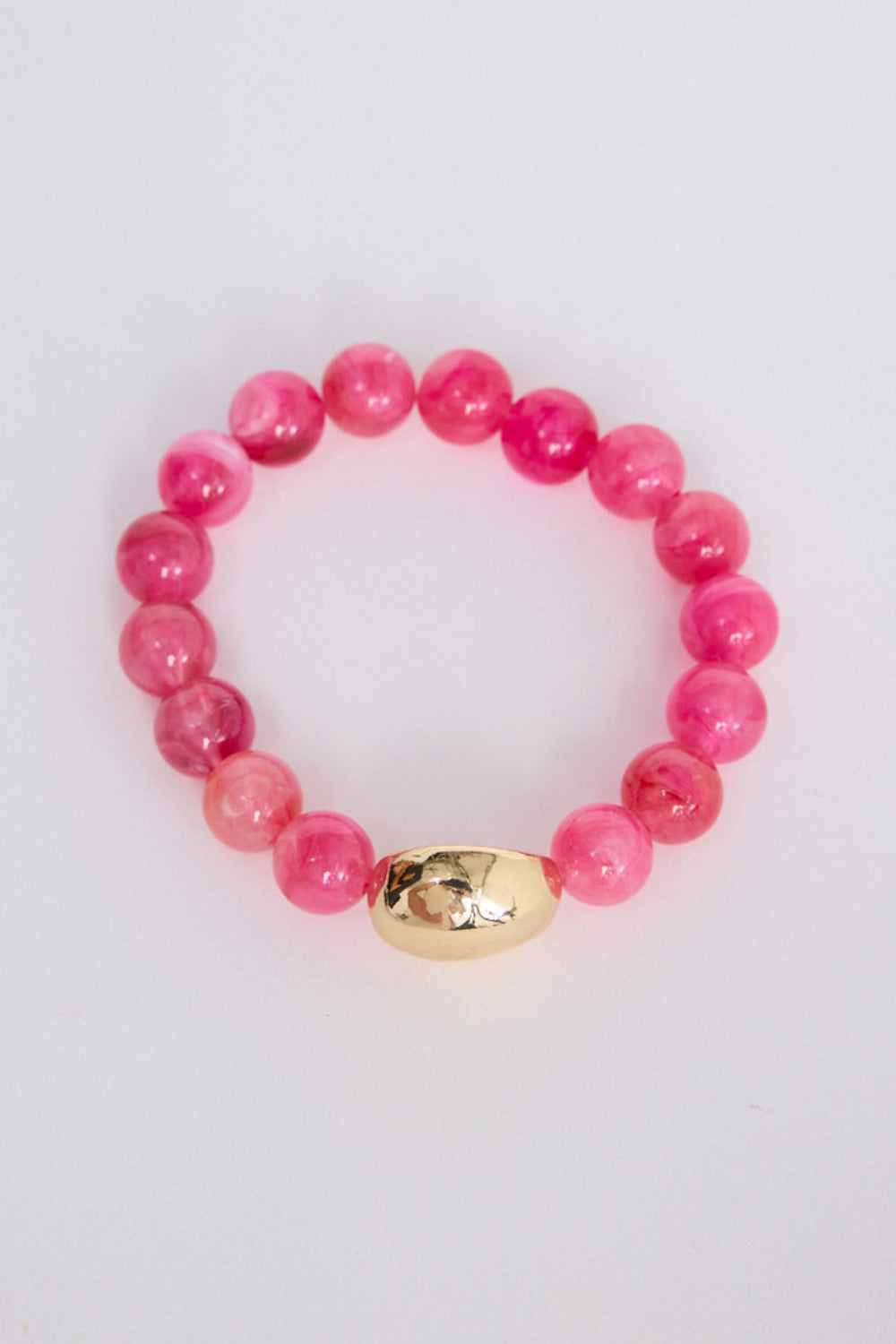 Molly Bracelet in hot pink with smooth rounded beads, front view on white background