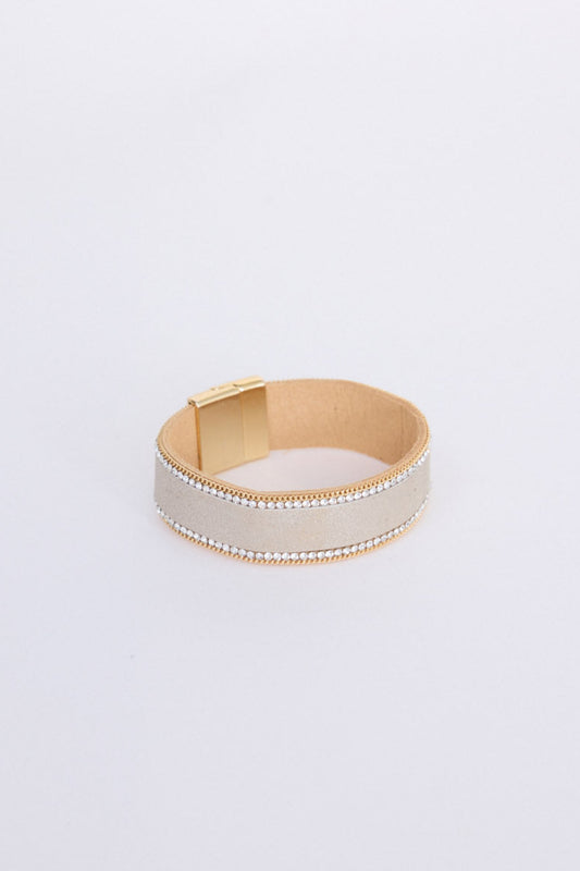 Hilda Bracelet in gold with delicate crystal detailing, angled view on white background