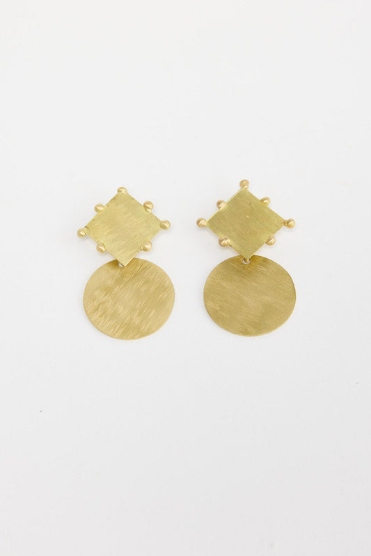 Pair of gold-tone two-piece drop earrings with a hammered square stud and a large hammered round disc pendant, laid flat on a white background