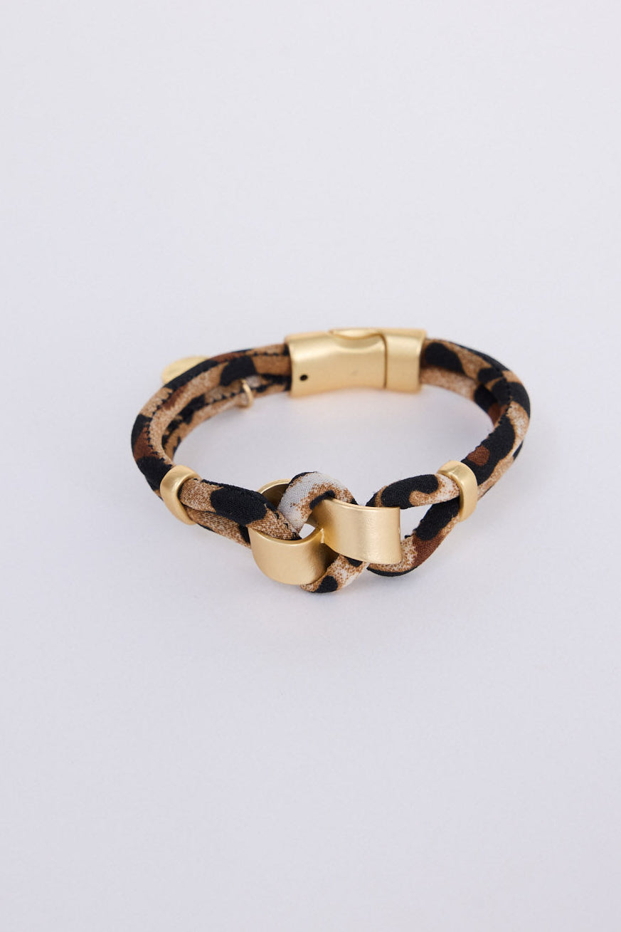 Kazima Leopard Bracelet in leopard with bold knot detailing and metal accents, front view on white background