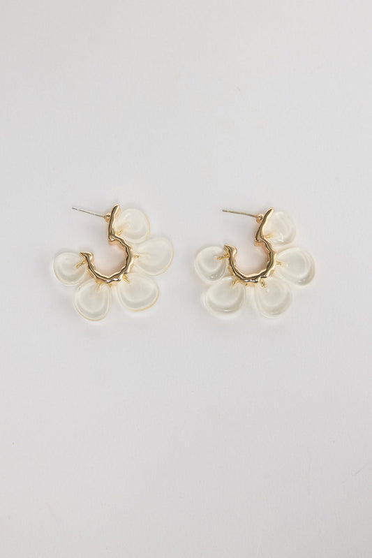 Matilda Earrings in Clear – gold-tone huggie earrings with five frosted clear resin flower petals, shown flat on a white background.