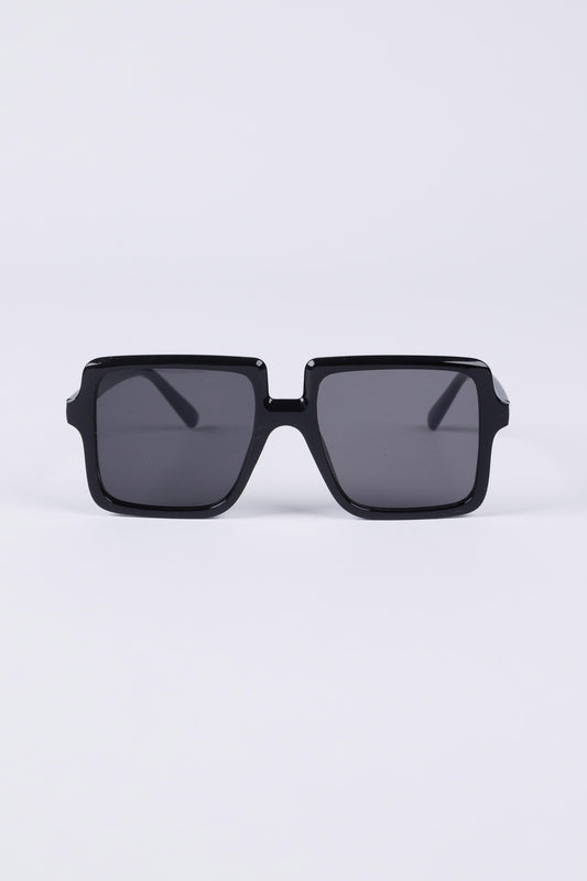 Black sunglasses with dark lenses on a light gray background