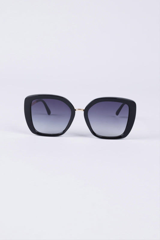 Black cat-eye sunglasses with gradient lenses on a light purple background